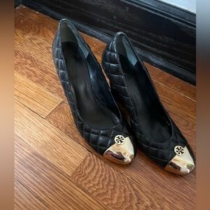 Tory Burch, quilted black, leather wedge heels.